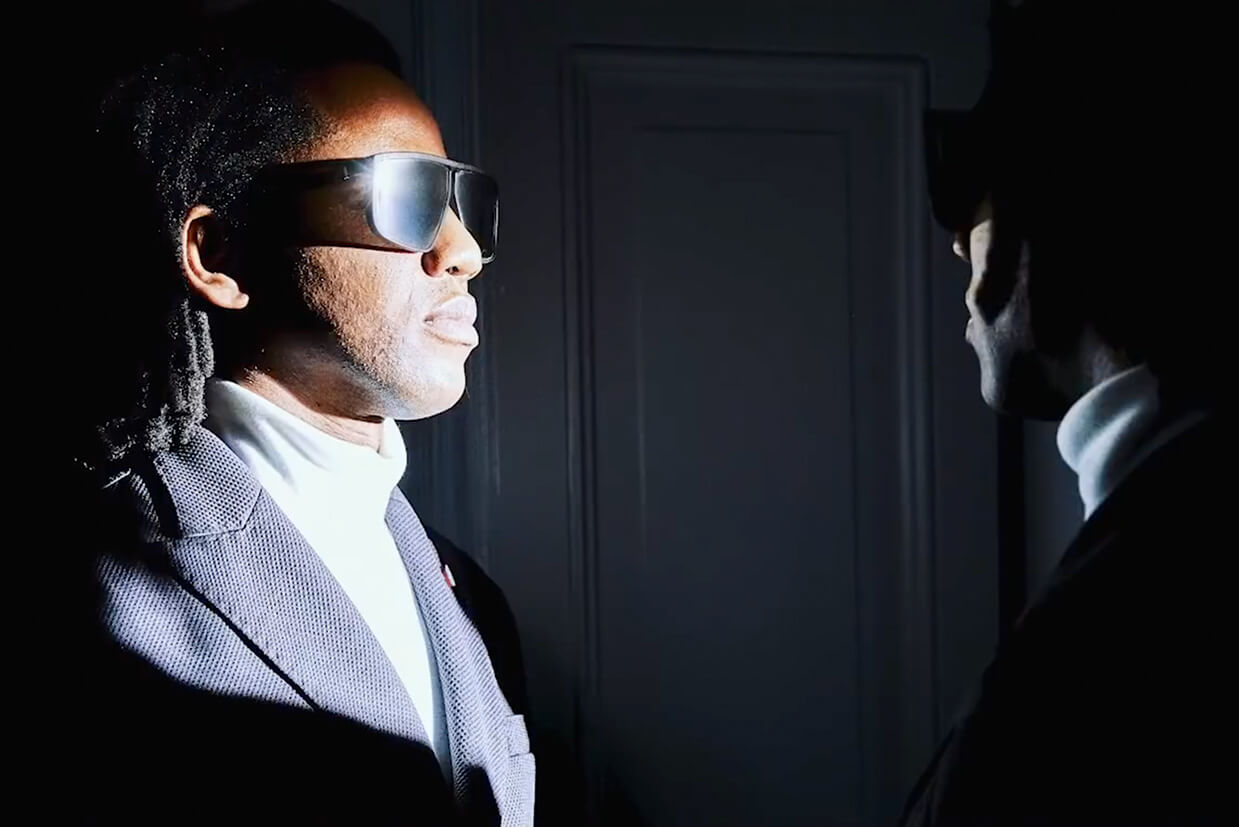Two men from the commercial shoot starring at each other